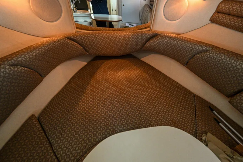 Slide: The Image of Interior cabin of a 2001 Sea Ray 260 Sundancer boat with cushioned seating. - 30
