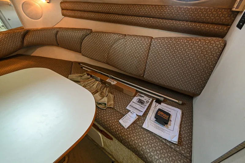 Slide: The Image of Interior of 2001 Sea Ray 260 Sundancer with seating area and table. - 31