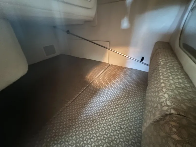 Slide: The Image of Interior cabin of a 2001 Sea Ray 260 Sundancer boat with patterned flooring. - 35