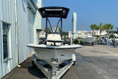 Slide: The Image of 2011 Mako 2201 Inshore boat on trailer, parked outside a building. - 3