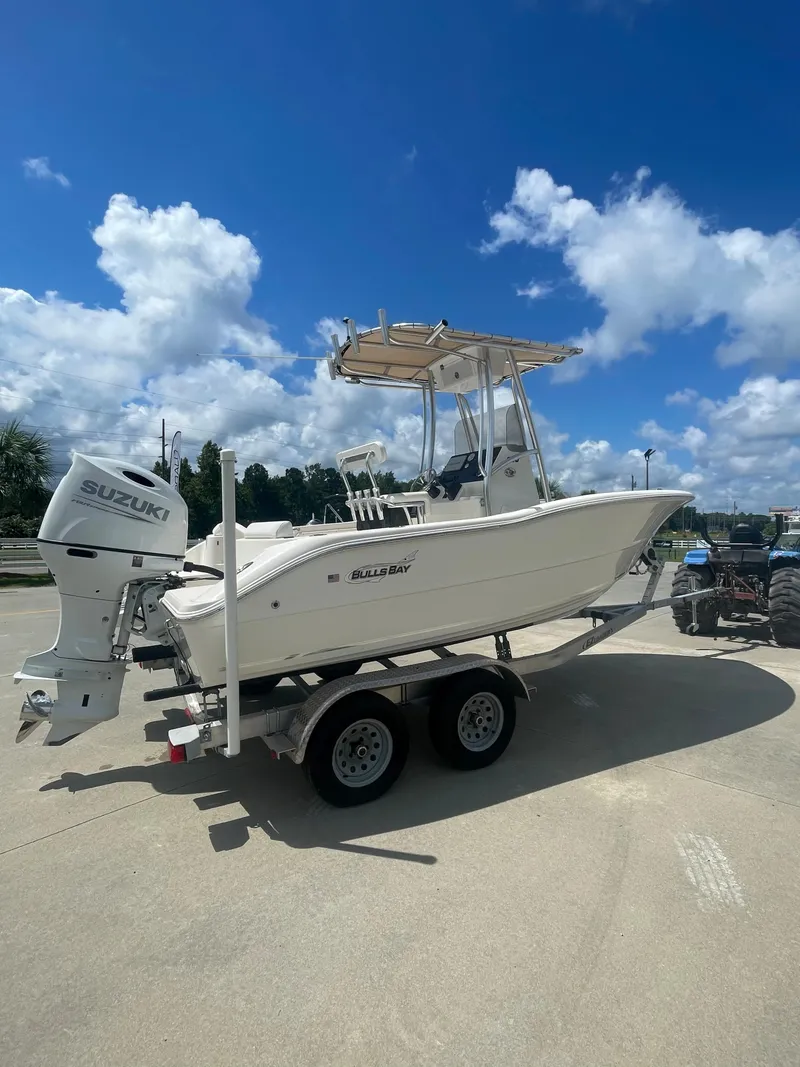 Slide: The Image of 2021 Bulls Bay 200 CC boat on trailer with Suzuki outboard motor. - 6