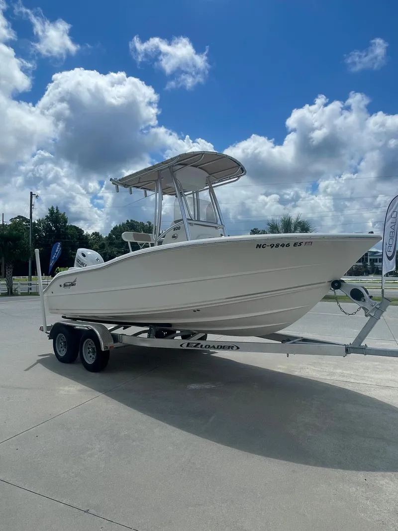 Slide: The Image of 2021 Bulls Bay 200 CC boat on trailer under cloudy sky. - 7