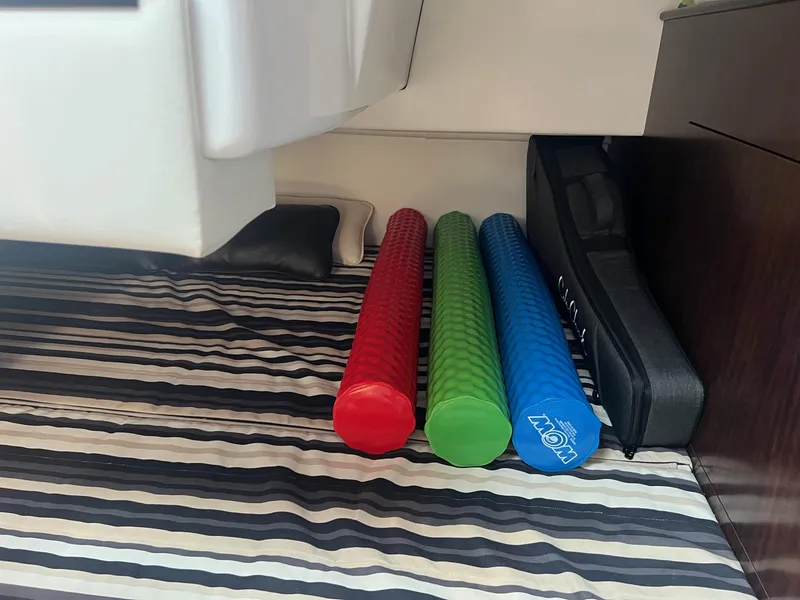 Slide: The Image of Foam rollers on striped bed in 2019 Monterey 295 Sport Yacht cabin. - 18