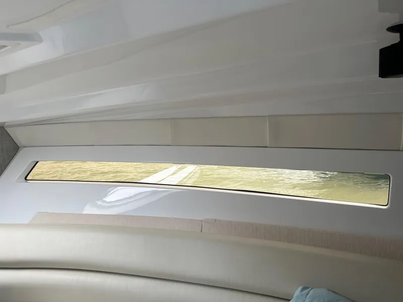 Slide: The Image of Interior view of 2019 Monterey 295 Sport Yacht window and seating. - 20