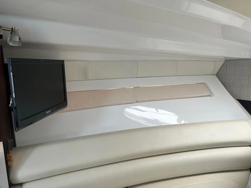 Slide: The Image of Interior of 2019 Monterey 295 Sport Yacht with TV and leather seating. - 21