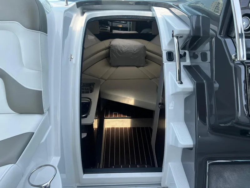 Slide: The Image of 2019 Monterey 295 Sport Yacht cabin interior with seating and modern design. - 23