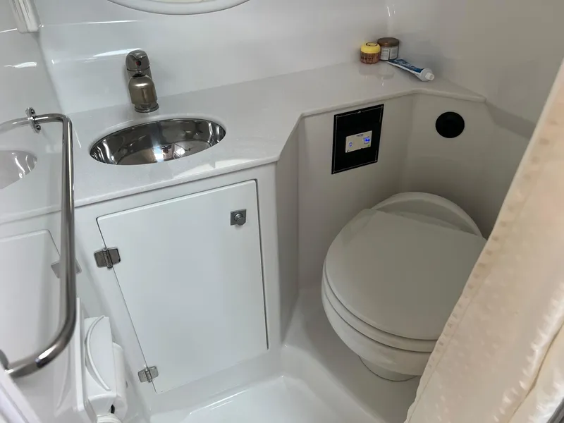 Slide: The Image of 2019 Monterey 295 Sport Yacht bathroom with sink and toilet. - 27