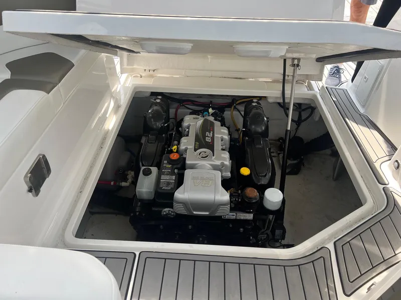 Slide: The Image of 2019 Monterey 295 Sport Yacht engine compartment with open hatch. - 6
