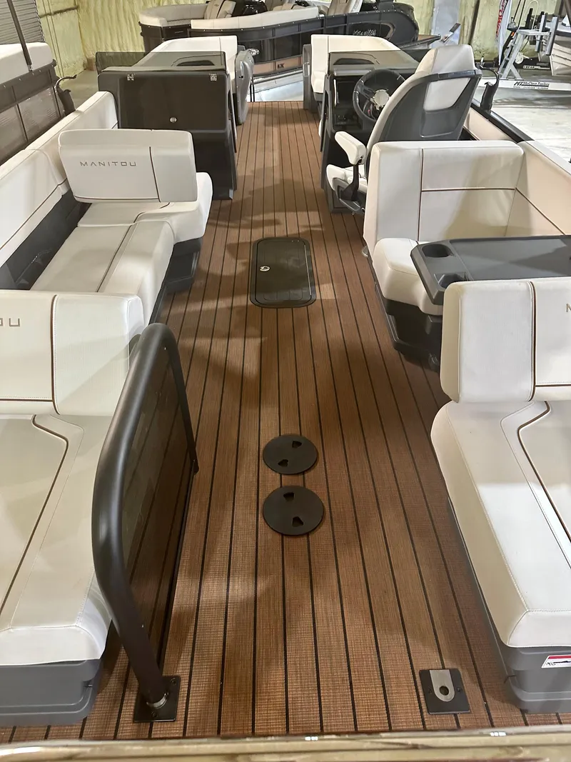 Slide: The Image of 2023 Manitou 26 Explore Switchback pontoon boat with trifold bench and luxurious seating. - 3