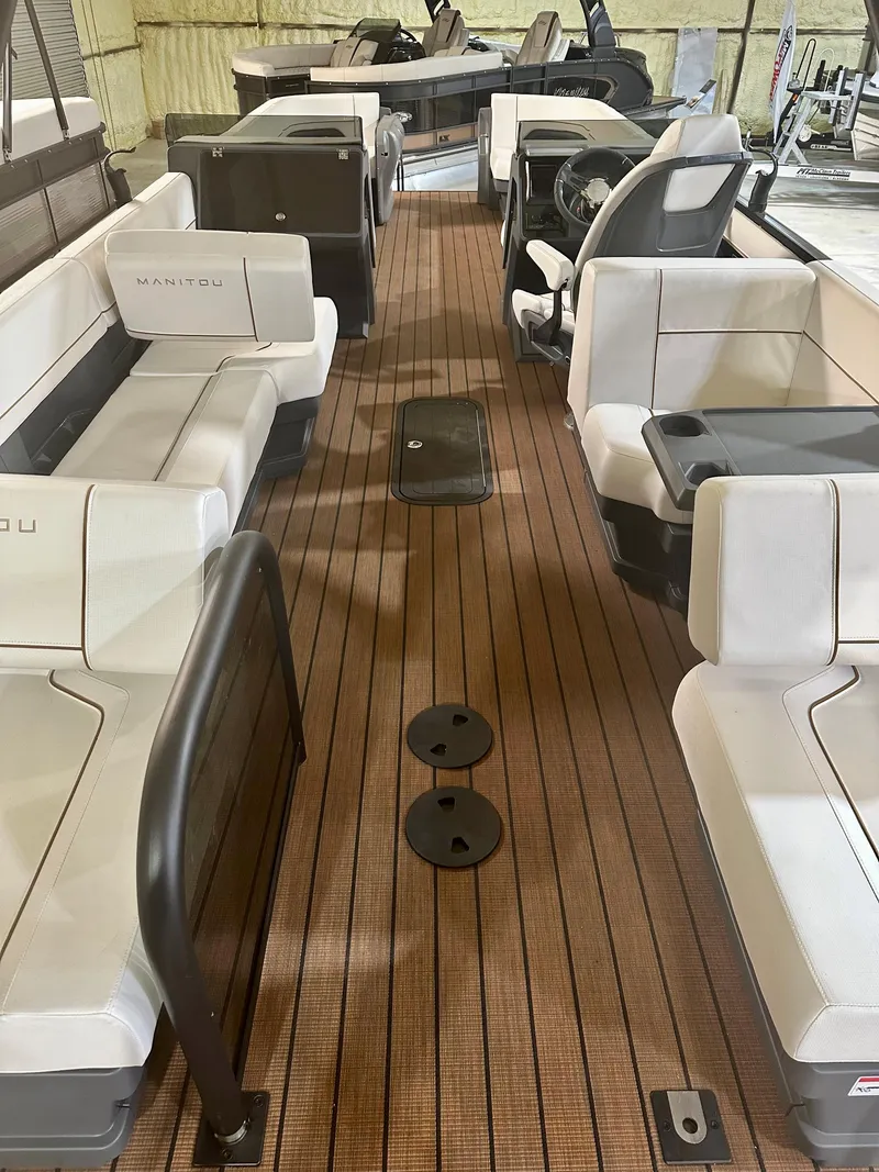 Slide: The Image of 2023 Manitou 26 Explore Switchback pontoon boat with trifold bench and spacious seating. - 4