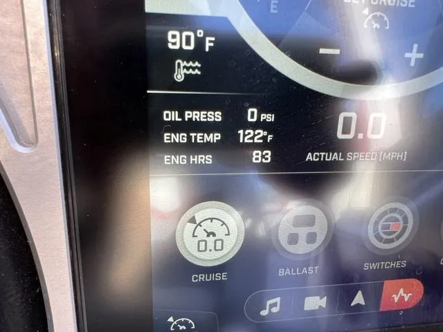 Slide: The Image of Close-up of 2022 Tigé 23ZX boat dashboard display showing engine stats. - 11