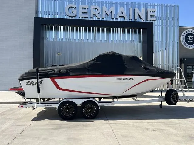 Slide: The Image of 2022 Tigé 23ZX boat on trailer with cover at Germaine dealership. - 5