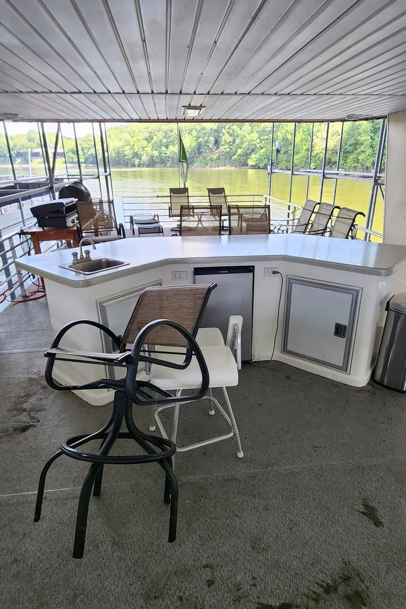 Slide: The Image of 2007 Destination Yachts 16x58 houseboat with outdoor seating and bar area. - 10