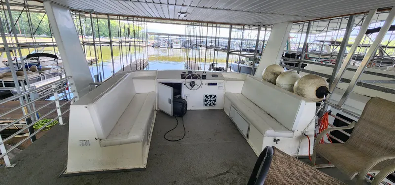 Slide: The Image of 2007 Destination Yachts 16x58 houseboat interior with seating and helm station. - 11
