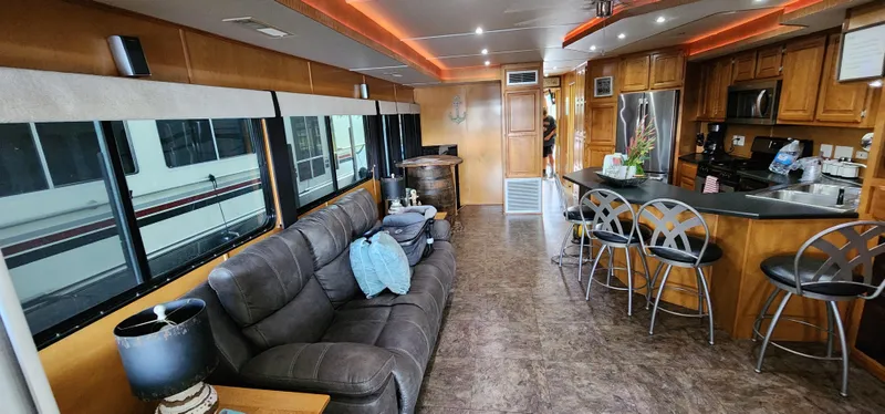 Slide: The Image of Interior of 2007 Destination Yachts 16x58 houseboat with modern kitchen and comfortable seating. - 13
