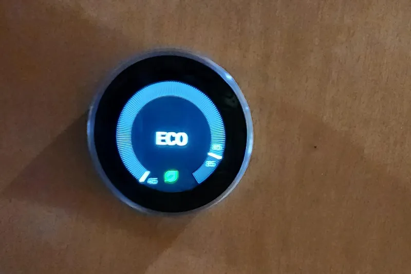 Slide: The Image of Digital thermostat displaying ECO mode on a 2007 Destination Yachts 16x58. - 28