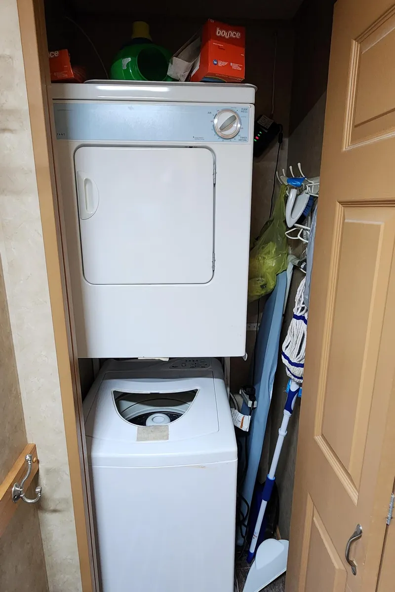 Slide: The Image of Stacked washer and dryer in a 2007 Destination Yachts 16x58. - 36