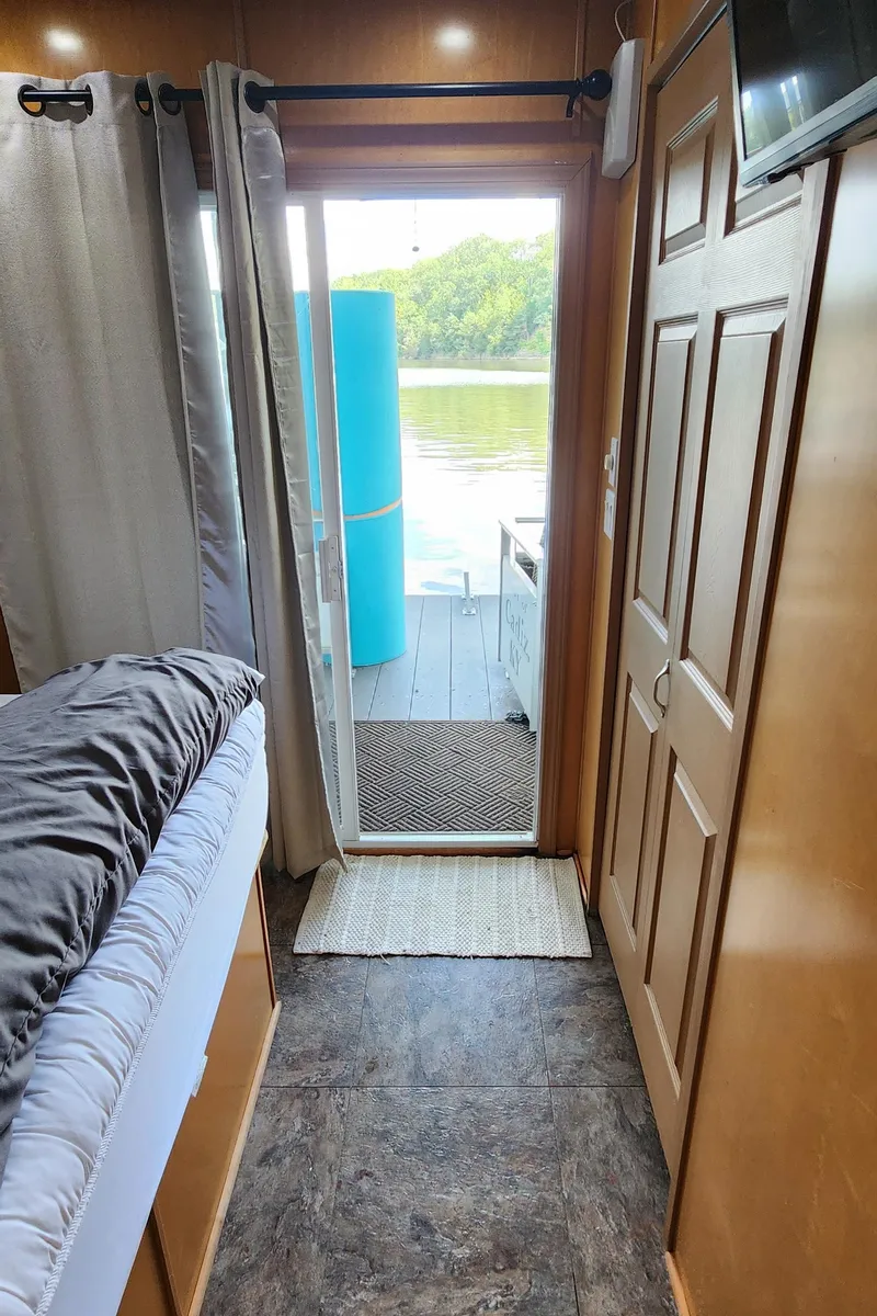 Slide: The Image of Interior view of 2007 Destination Yachts 16x58 houseboat with open door to deck. - 38