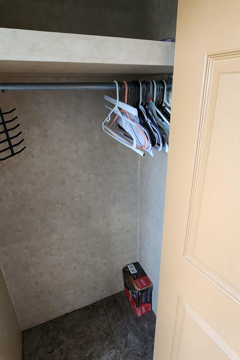 Slide: The Image of Small closet with hangers and a shelf in a 2007 Destination Yachts 16x58. - 41