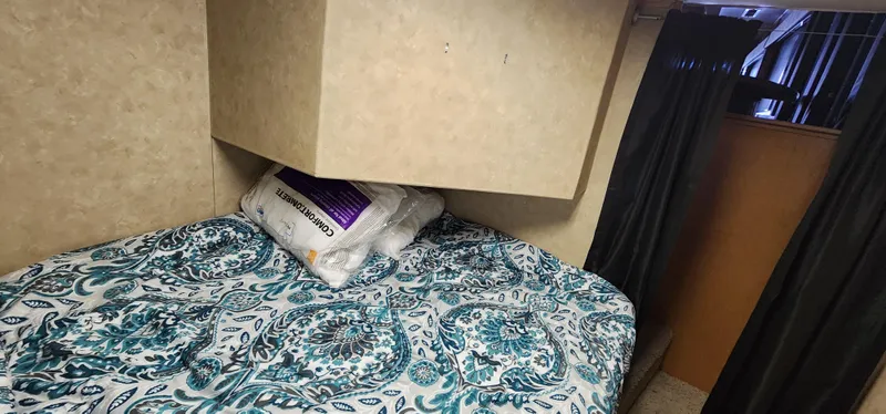 Slide: The Image of 2007 Destination Yachts 16x58 houseboat bedroom with patterned bedding. - 42