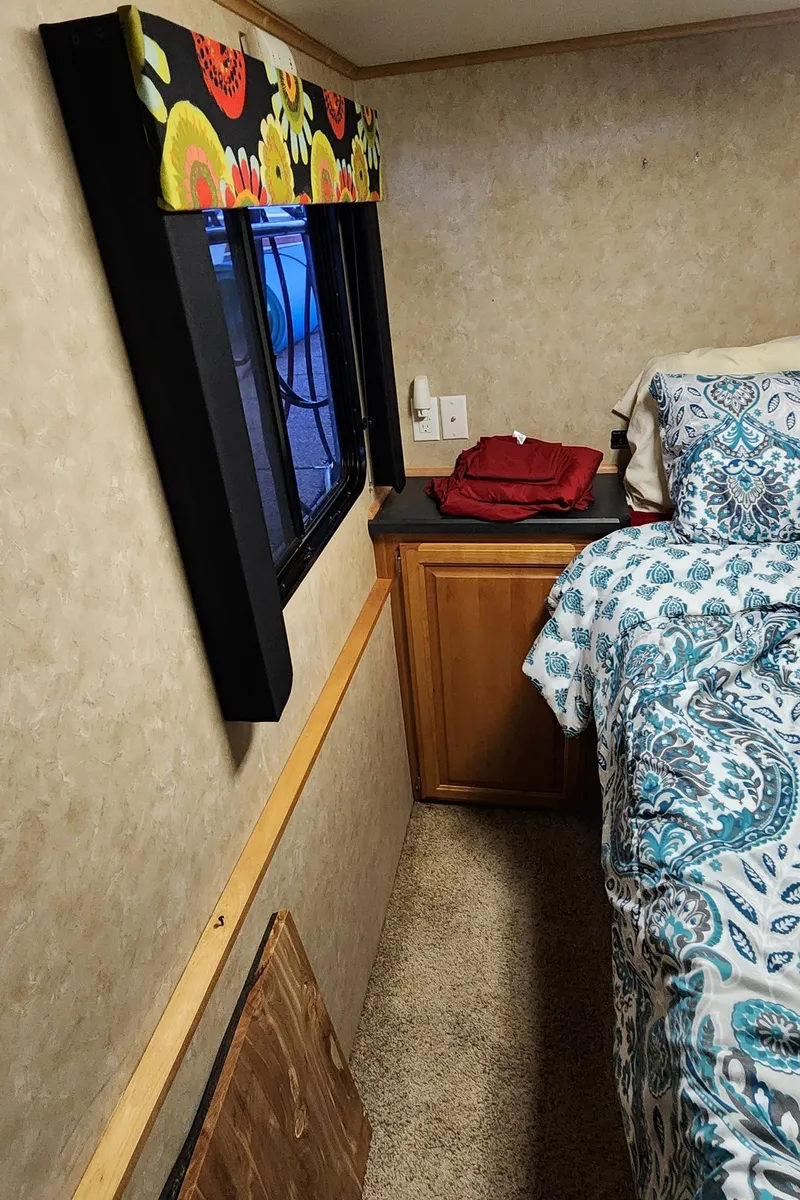 Slide: The Image of Interior of 2007 Destination Yachts 16x58 houseboat bedroom with window and bed. - 49