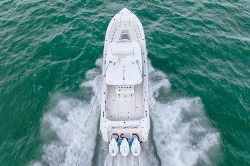 Slide: The Image of Aerial view of a 2022 Intrepid 375 Nomad FE boat cruising on the water. - 10