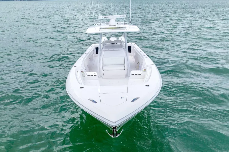 Slide: The Image of 2022 Intrepid 375 Nomad FE boat on open water. - 12