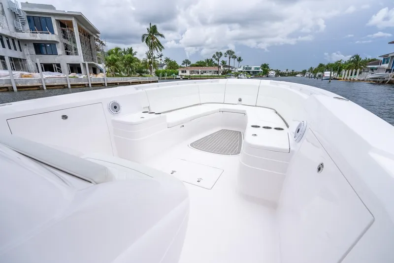 Slide: The Image of 2022 Intrepid 375 Nomad FE boat with spacious seating area and modern design. - 23