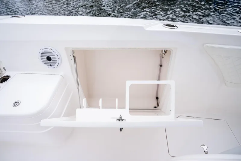 Slide: The Image of 2022 Intrepid 375 Nomad FE boat storage compartment and speaker. - 30