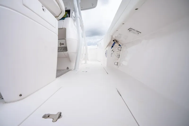 Slide: The Image of 2022 Intrepid 375 Nomad FE boat interior, white deck and seating. - 31