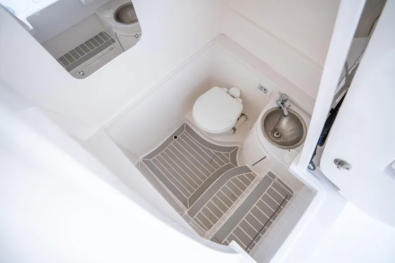 Slide: The Image of 2022 Intrepid 375 Nomad FE boat bathroom with toilet and sink. - 40