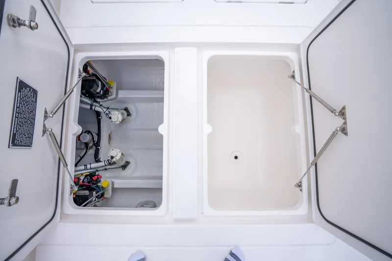 Slide: The Image of Open storage compartments on a 2022 Intrepid 375 Nomad FE boat. - 43