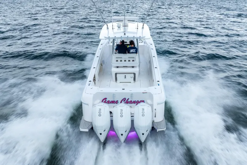 Slide: The Image of 2022 Intrepid 375 Nomad FE boat speeding on the ocean. - 7