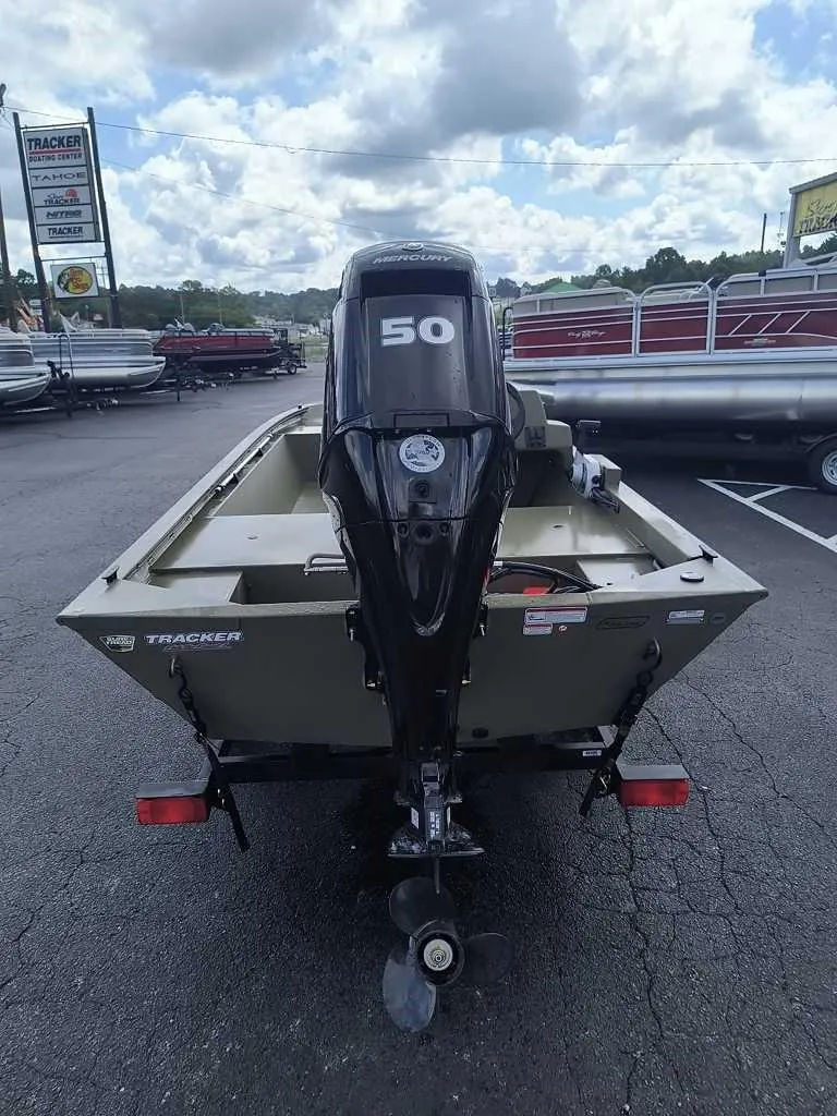 Slide: The Image of 2024 Tracker Grizzly 1648 SC boat with 50 HP motor in dealership lot. - 3