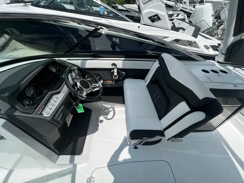 Slide: The Image of 2024 Monterey 275 Super Sport boat interior with steering wheel and seating. - 17