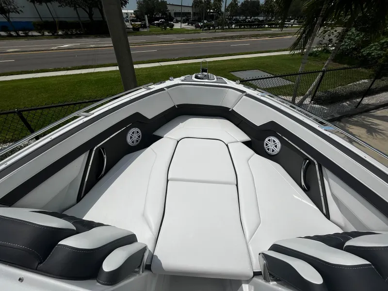 Slide: The Image of 2024 Monterey 275 Super Sport boat with luxurious white seating. - 25