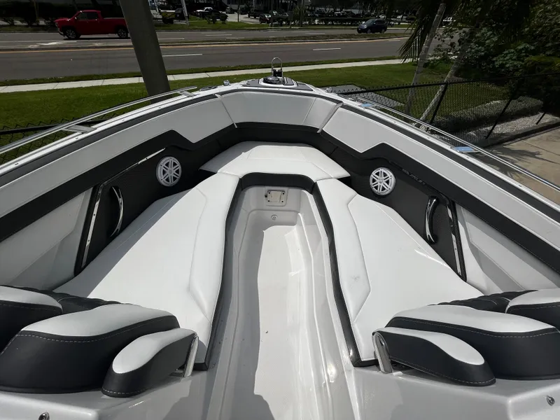 Slide: The Image of 2024 Monterey 275 Super Sport boat interior with white and black seating. - 26