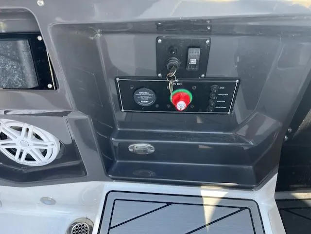 Slide: The Image of Control panel of a 2024 Monterey 275 Super Sport boat with speaker and switches. - 34