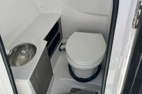 Slide: The Image of 2024 Monterey 275 Super Sport boat bathroom with toilet and sink. - 37