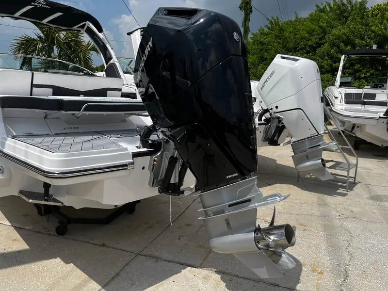 Slide: The Image of 2024 Monterey 275 Super Sport boat with powerful outboard engines. - 5