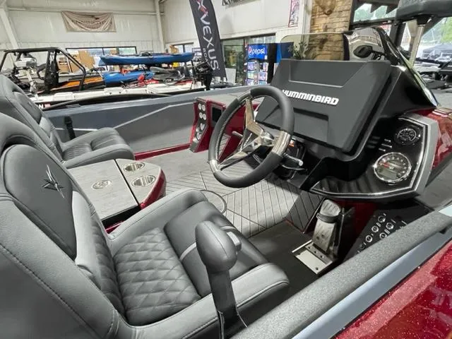 Slide: The Image of 2023 Vexus VX20 boat interior with steering console and seating. - 5