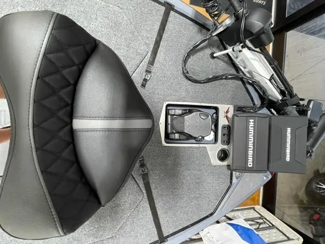 Slide: The Image of 2023 Vexus VX20 boat interior with Humminbird electronics and black leather seat. - 7