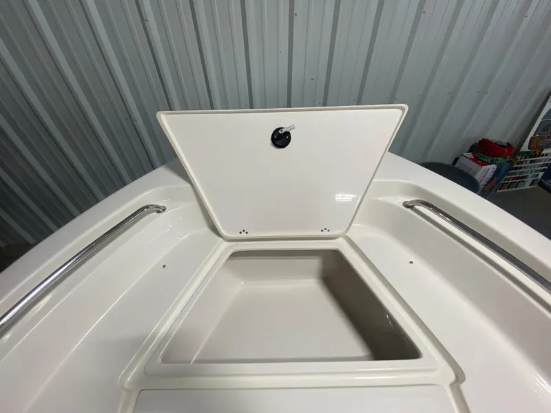 Slide: The Image of 2024 Key West 189 FS boat storage compartment with open hatch. - 23