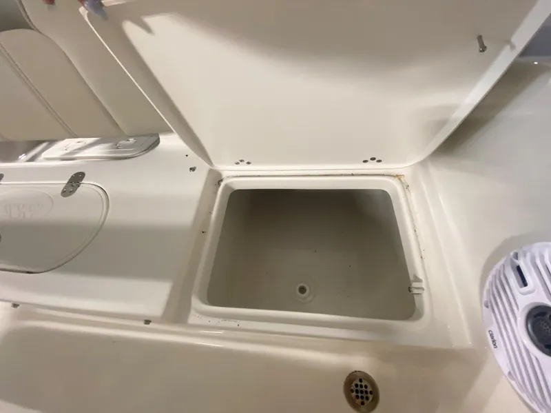 Slide: The Image of Open storage compartment on a 2024 Key West 189 FS boat. - 8