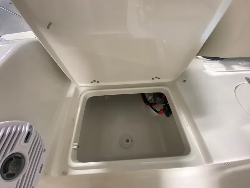 Slide: The Image of Open storage compartment on a 2024 Key West 189 FS boat. - 10