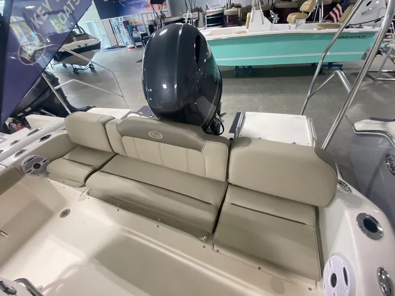 Slide: The Image of 2024 Key West 189 FS boat with rear seating and outboard motor. - 11