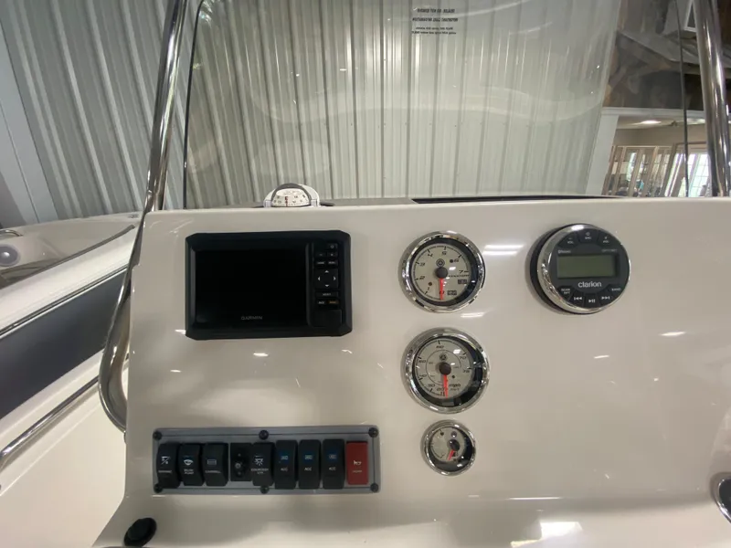 Slide: The Image of 2024 Key West 189 FS boat dashboard with gauges and control panel. - 14