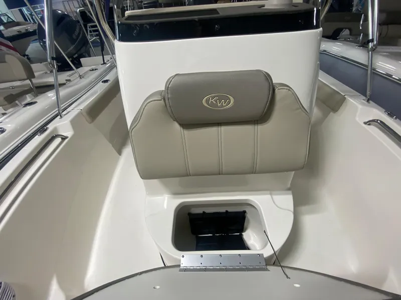 Slide: The Image of 2024 Key West 189 FS boat interior with cushioned seating and storage compartment. - 20