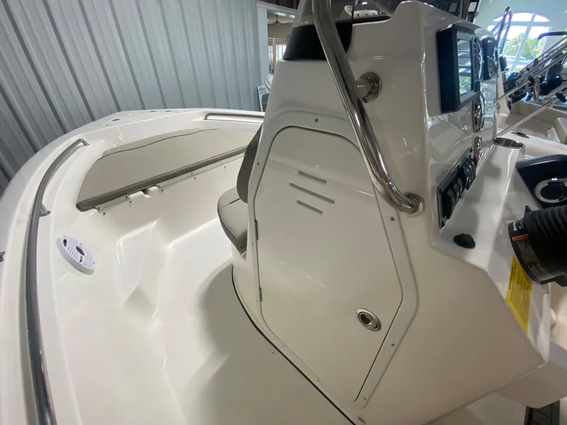 Slide: The Image of 2024 Key West 189 FS boat interior, white console and seating area. - 16