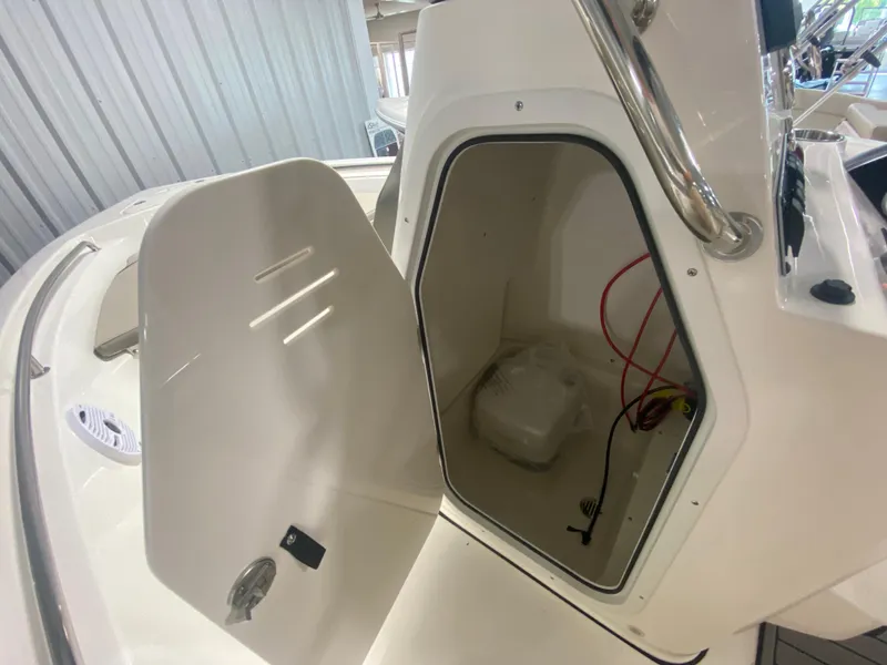 Slide: The Image of 2024 Key West 189 FS boat storage compartment with open hatch. - 17